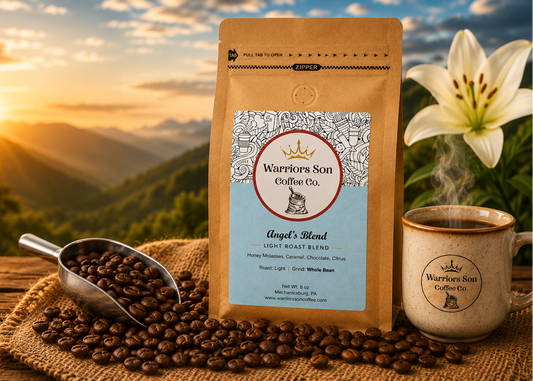 Warriors Son Coffee Co. packaging with coffee beans, a scoop, and a mug against a scenic mountain backdrop.