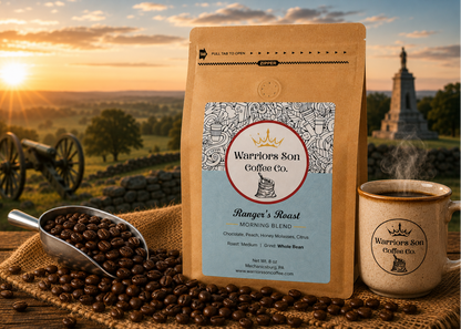 Warrior's Son Coffee Co. package with coffee beans and a mug against a scenic background